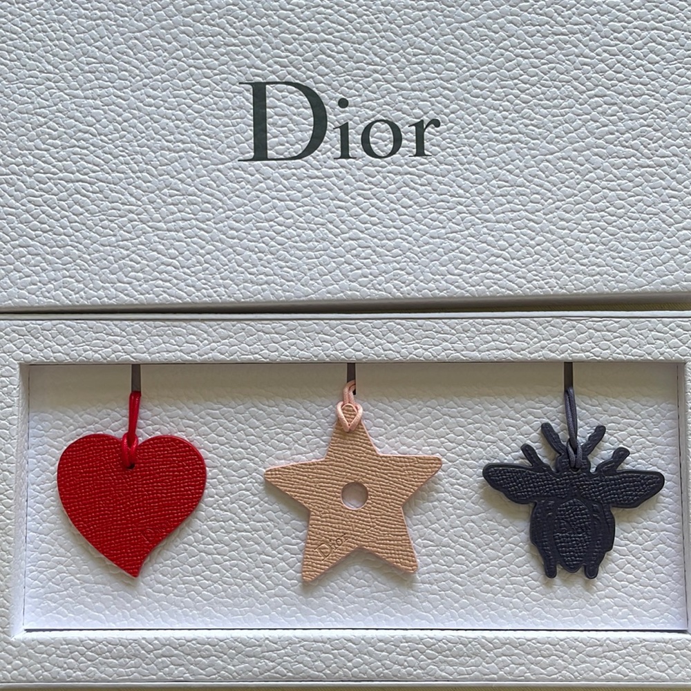 Christian Dior set of three bag charms, new in box